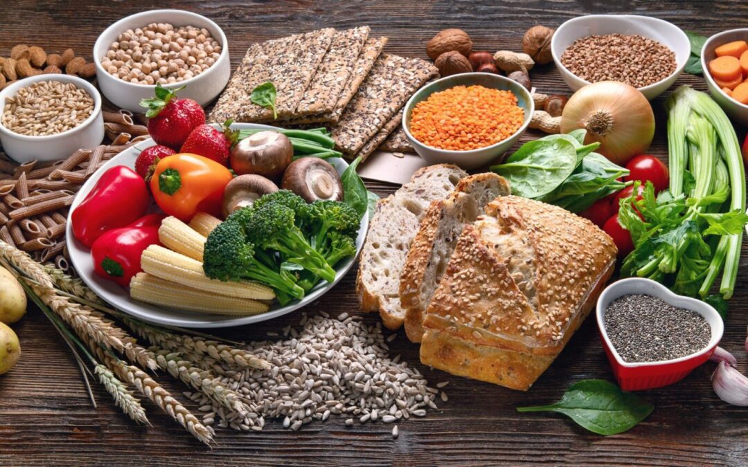 a variety of foods are arranged on a wooden table