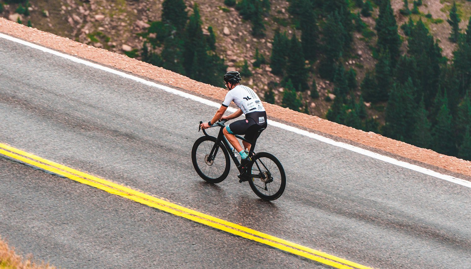 Man Riding a Bicycle on the Road